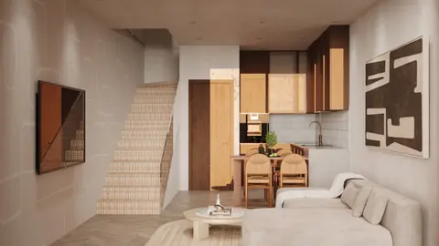 Duplex living room with stairs to the second level